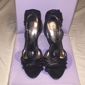 Black high heels with straps.